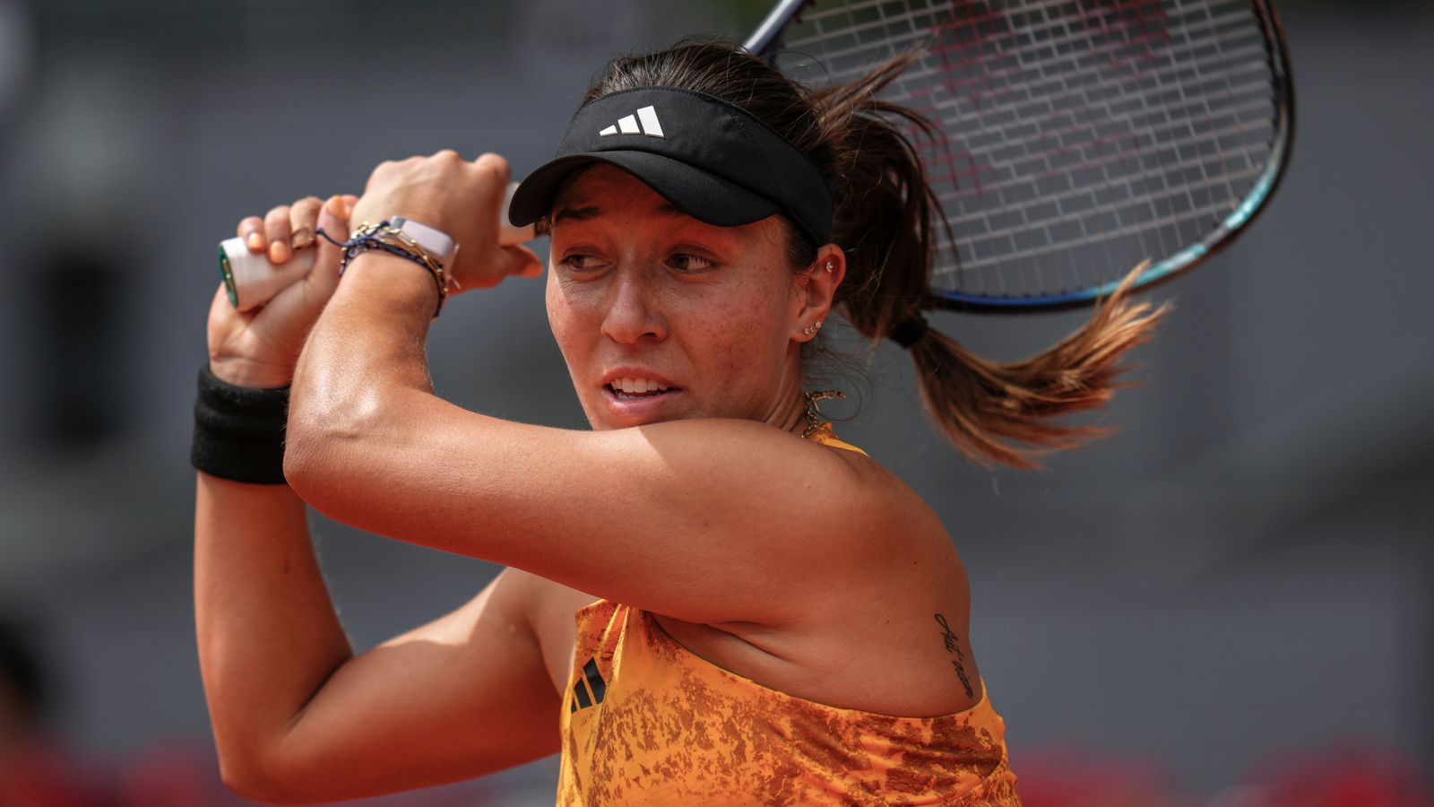Jessica Pegula of the U.S. returns the ball against Marie Bouzkova, of the Czech Republic, during their match at the Madrid Open tennis tournament in Madrid, Spain, Sunday, April 30, 2023. (AP Photo/Manu Fernandez)
