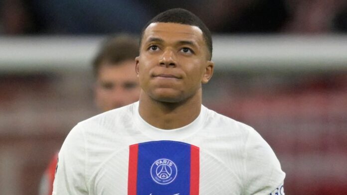 PSG&#39;s Kylian Mbappe reacts after Bayern&#39;s Eric Maxim Choupo-Moting scored his side&#39;s opening goal during the Champions League round of 16 second leg soccer match between Bayern Munich and Paris Saint Germain at the Allianz Arena in Munich, Germany, Wednesday, March 8, 2023. (AP Photo/Andreas Schaad)
