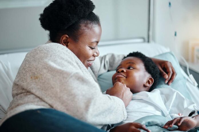 Hospital, bed and mother with girl for support or comfort for treatment of Respiratory syncytial virus. Black mom, kid and together in clinic for healthcare, medical services and recovery of illness.; Shutterstock ID 2442075933; purchase_order: -; job: -; client: -; other: -